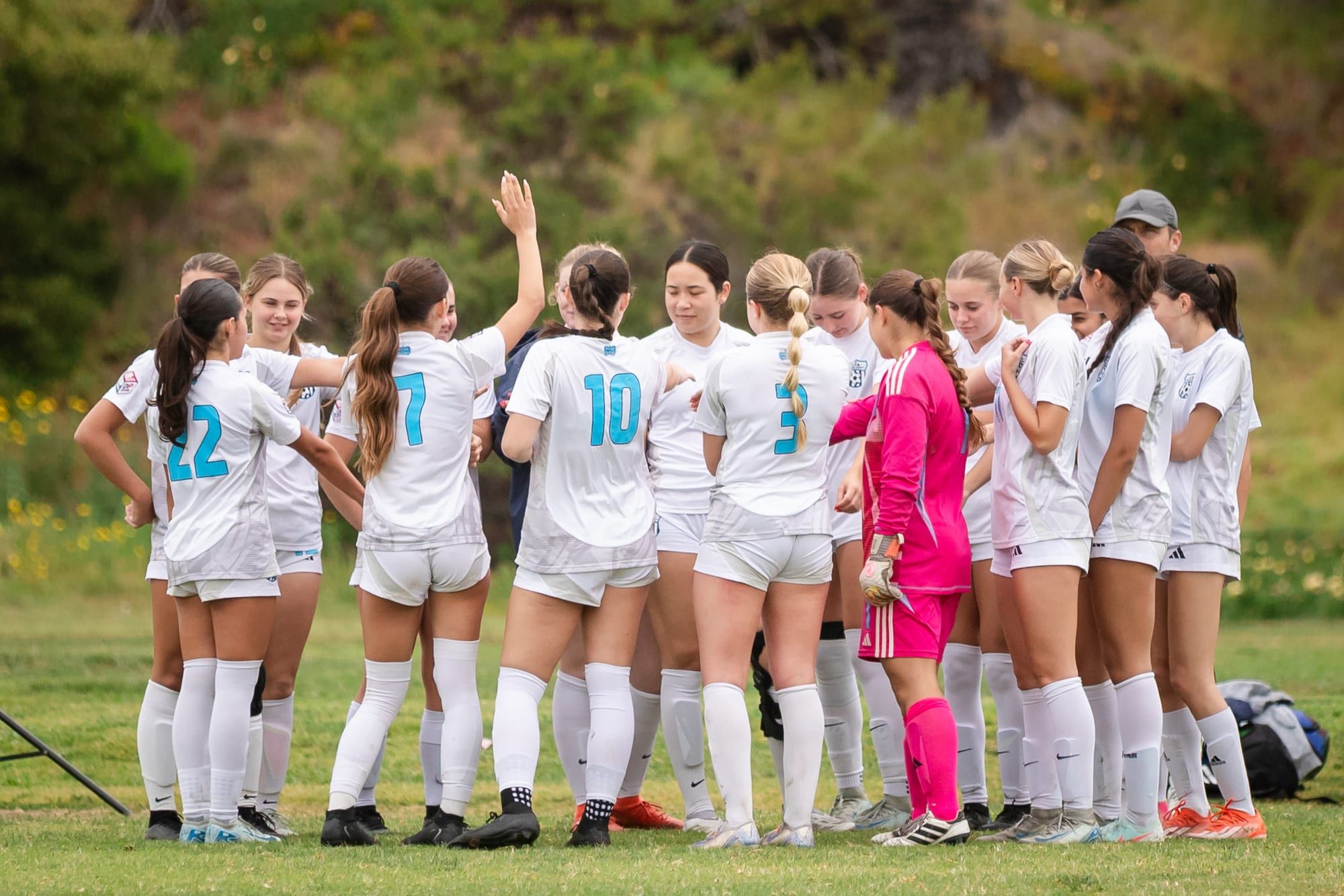 CFA girls team celebrating together on the field